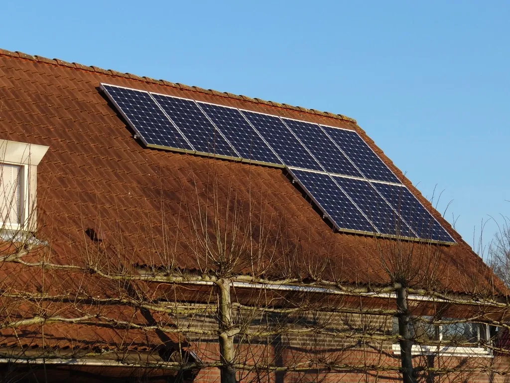 Solar panels on a terracotta tile roof